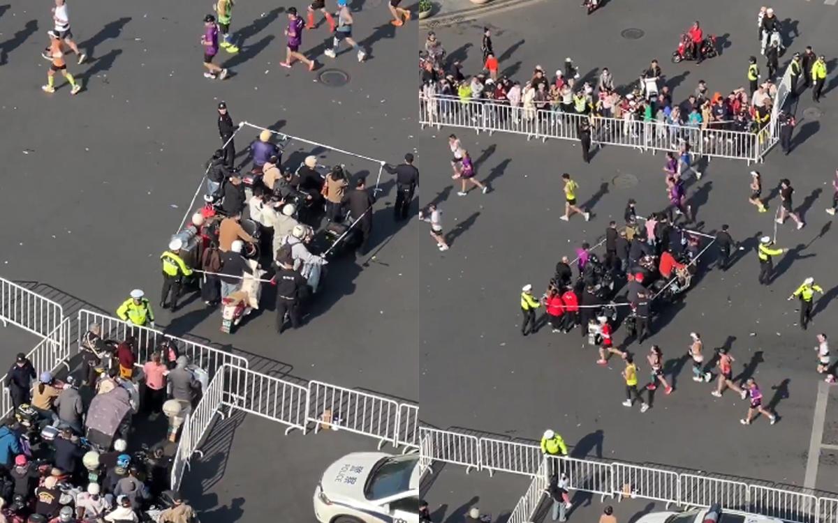 Aksi Unik Petugas Tiongkok Belah Rute Marathon Demi Warga Menyeberang