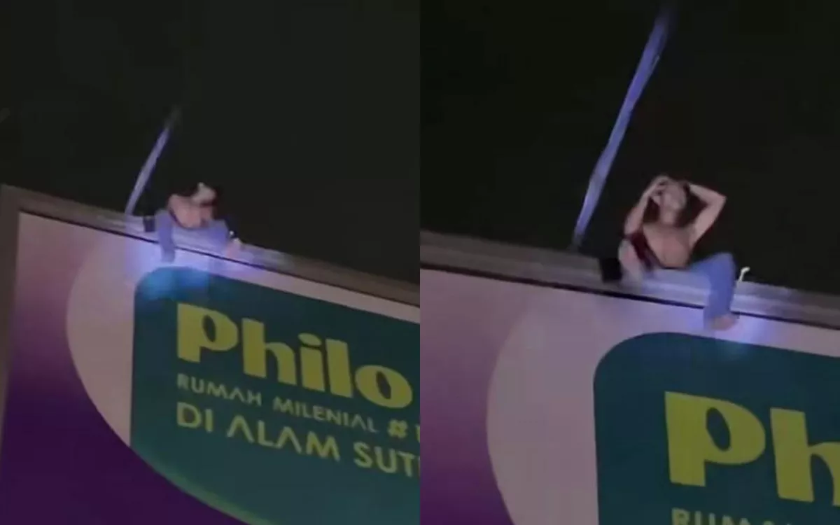 Aksi Nekat Pria Panjat Papan Reklame 20 Meter di Daan Mogot, Evakuasi Berlangsung Dramatis