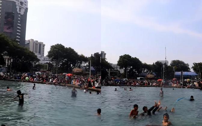 Monas Dipadati Warga Rayakan HUT TNI ke 80, Ada Pemandangan Unik Anak Berenang